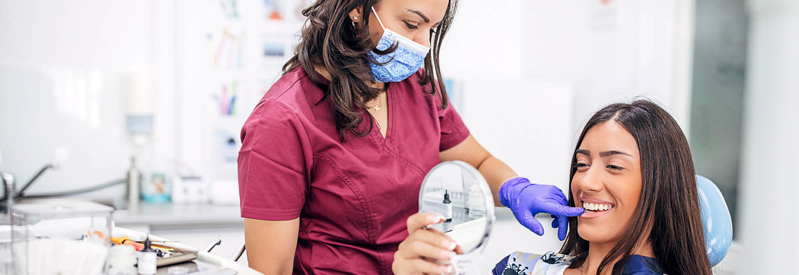 woman receiving advice from dentist 1600X552.jpg