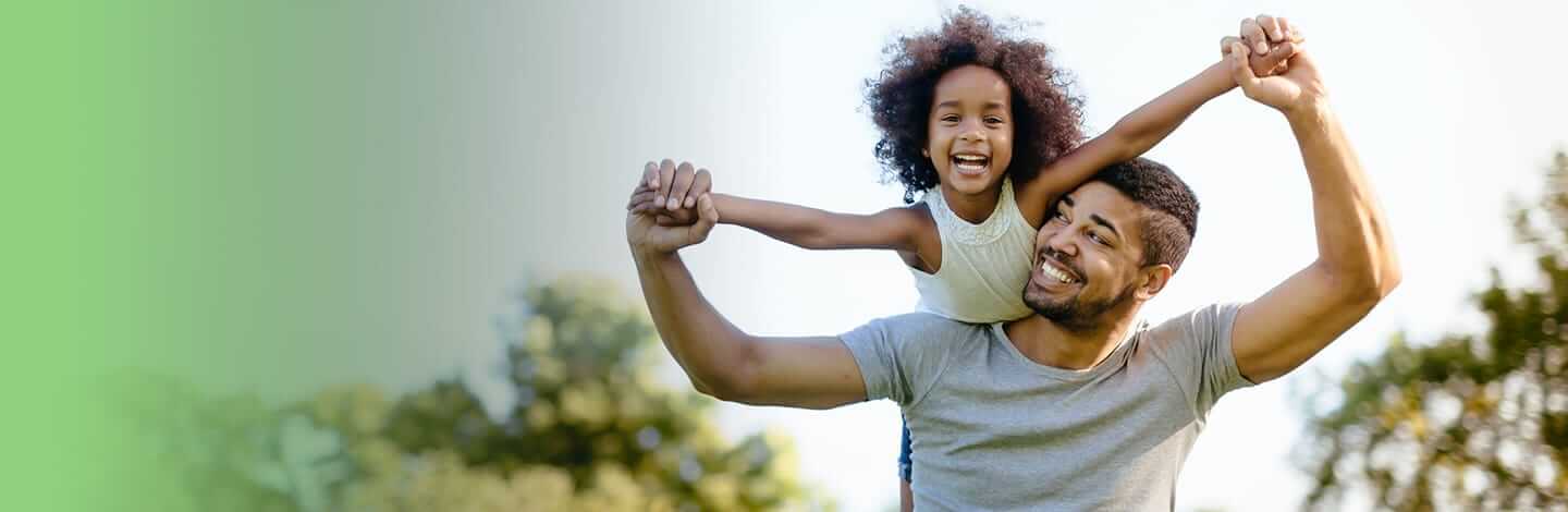 father giving daughter piggyback ride.jpg