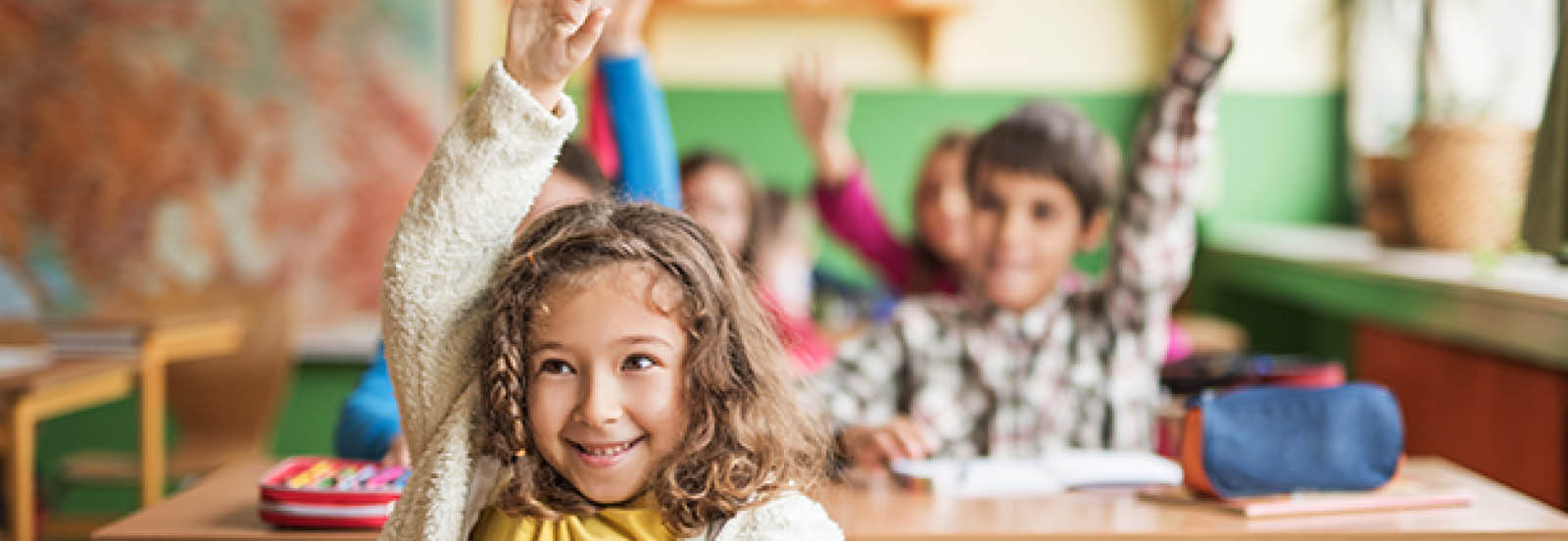 kids in school raising their hands desktop 1600x552.jpg