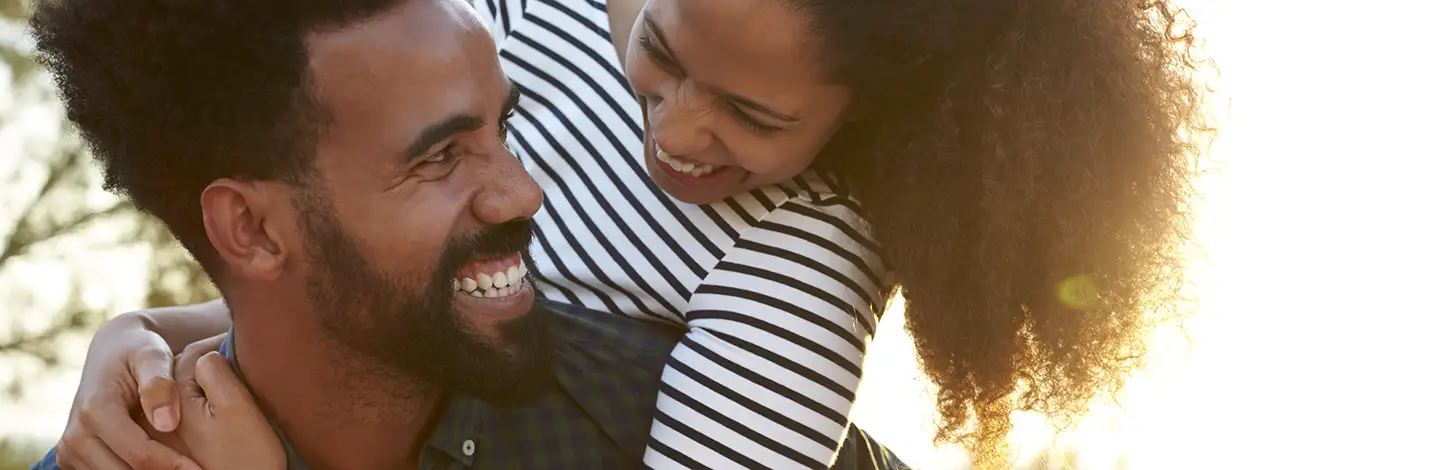 man and woman smiling and laughing