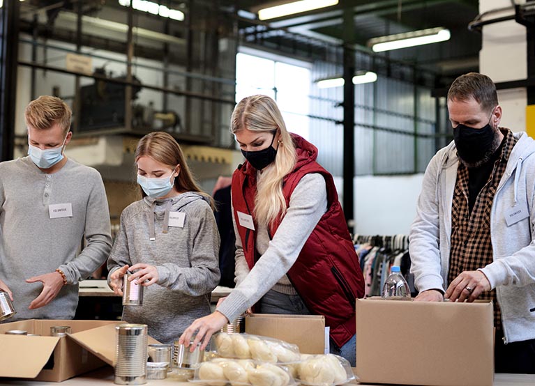 group of people gathering supplies for donation mobile.jpg