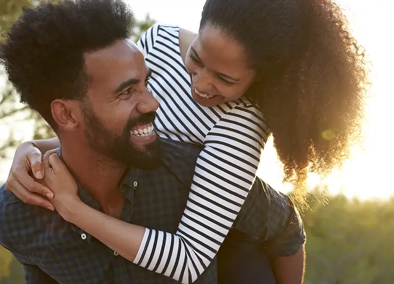 man and woman smiling and laughing