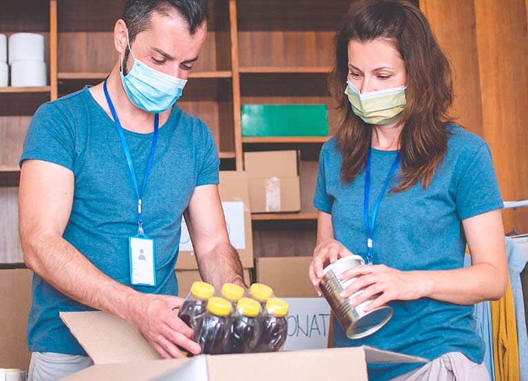 mand and woman doing volunteer work mobile.jpg
