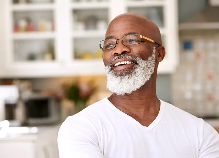 older gentleman with glasses looking to the side