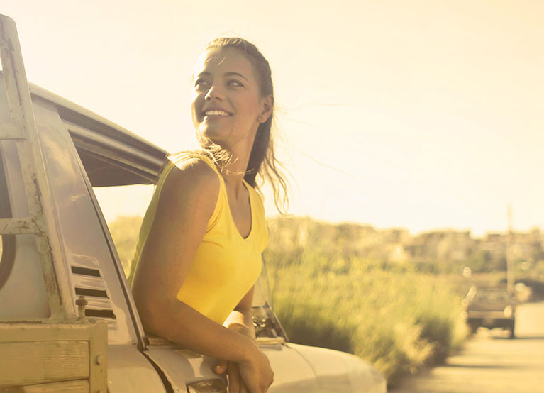 woman riding in a truck at sunset mobile.jpg