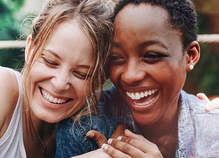 women friends laughing outside in the summer 2.jpg