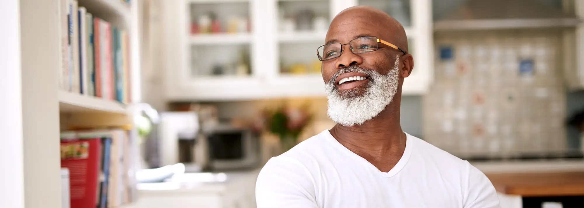 older gentleman with glasses looking to the side