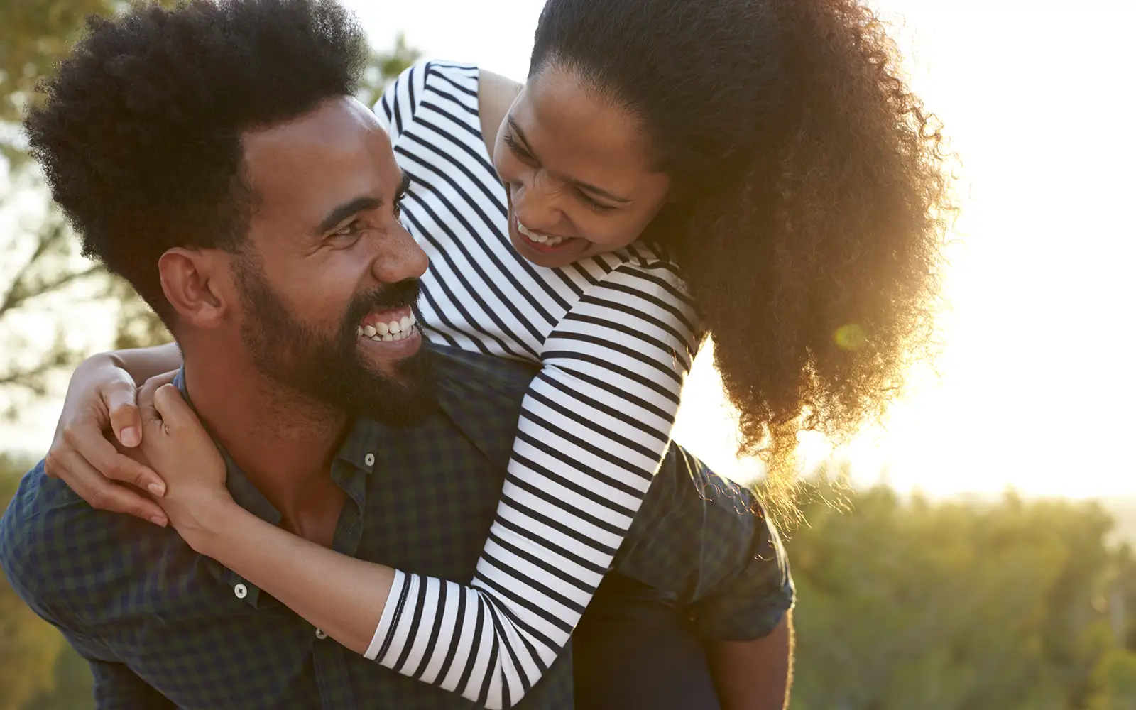 man and woman smiling and laughing