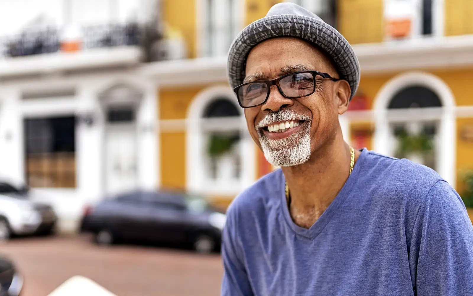 man with glasses smiling 1600x1000.webp