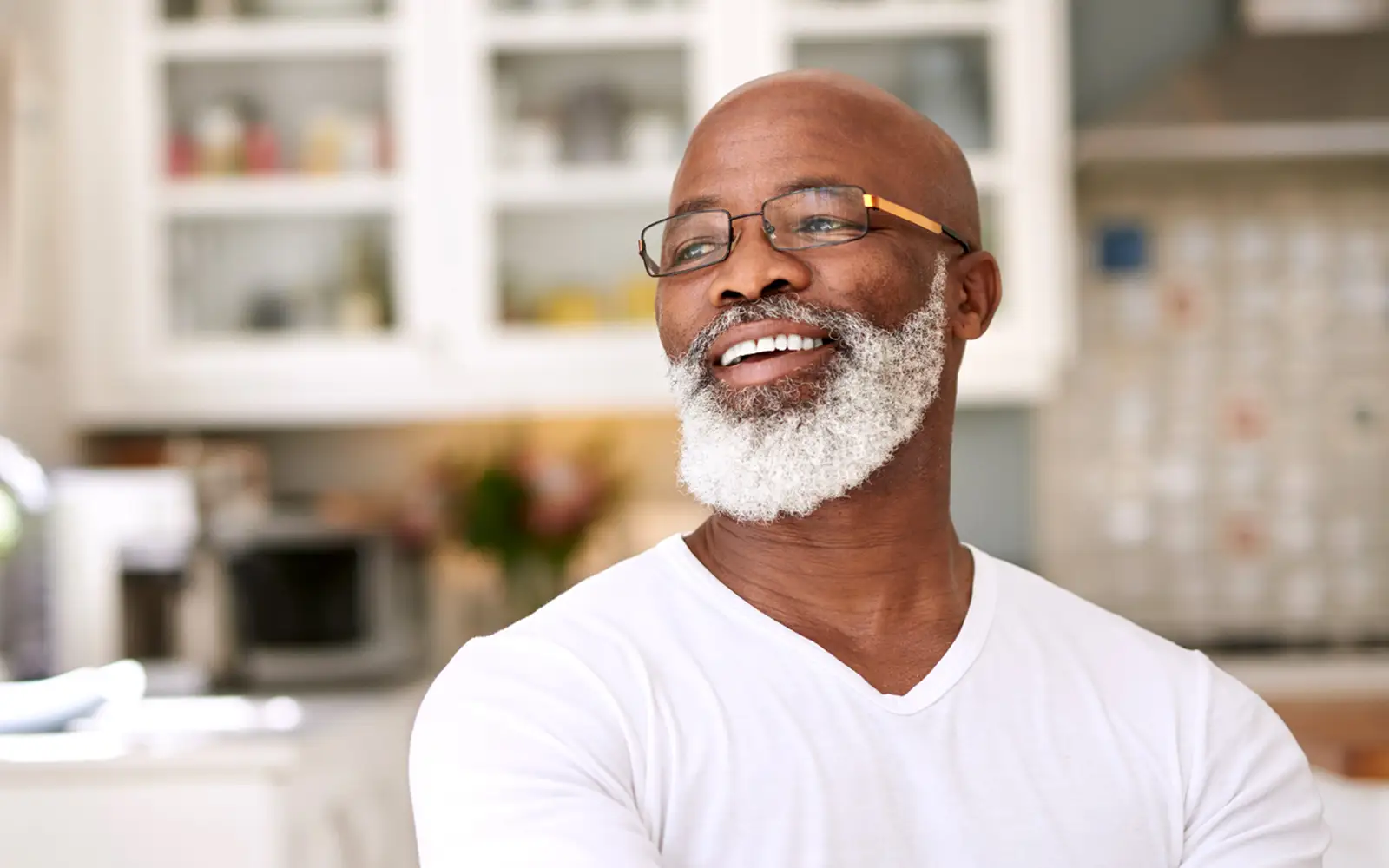 older gentleman with glasses looking to the side