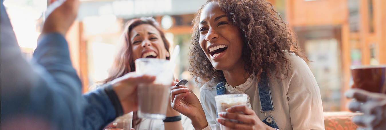 woman and friends drinking sugary drinks oral health desktop 1348X455.jpg