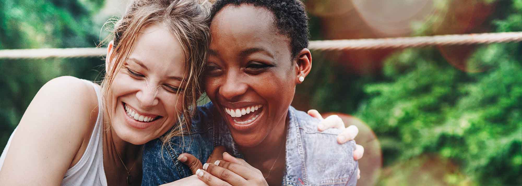 women friends laughing outside in the summer.jpg