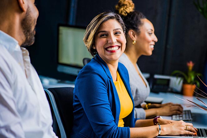 businesswoman smiling at coworker.jpg